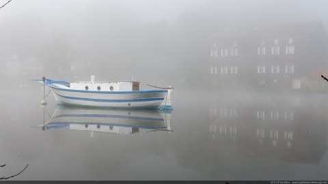 Boat, fog and reflection